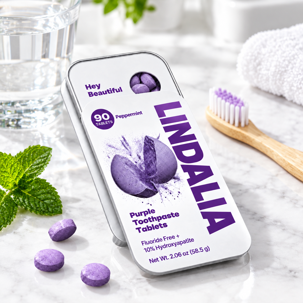 Lindalia purple toothpaste tablets tin on a bathroom counter